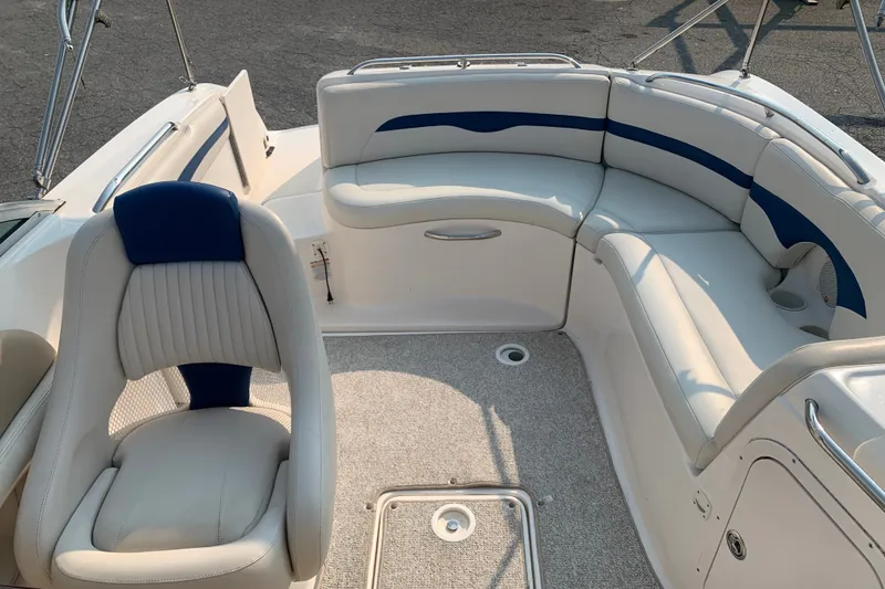 Slide: The Image of 2003 Chaparral Sunesta 236 boat interior with white and blue seating arrangement. - 6