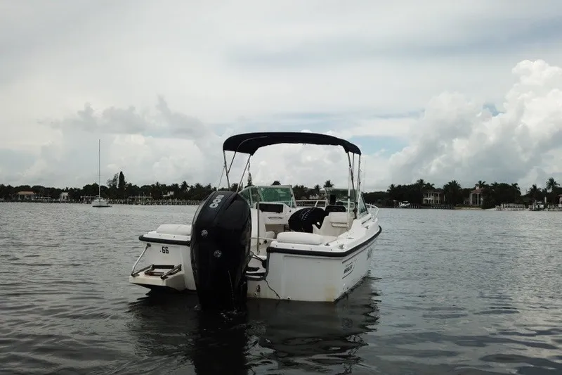 Slide: The Image of 1998 Boston Whaler 20 Ventura Bowrider on calm water, overcast sky. - 8