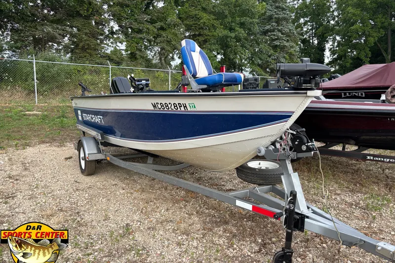 Slide: The Image of 1991 Starcraft Super Fisherman 170 boat on trailer, parked outdoors. - 4