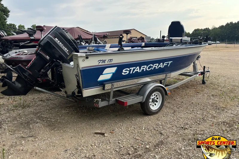 Slide: The Image of 1991 Starcraft Super Fisherman 170 boat on trailer, featuring Mercury outboard motor. - 2