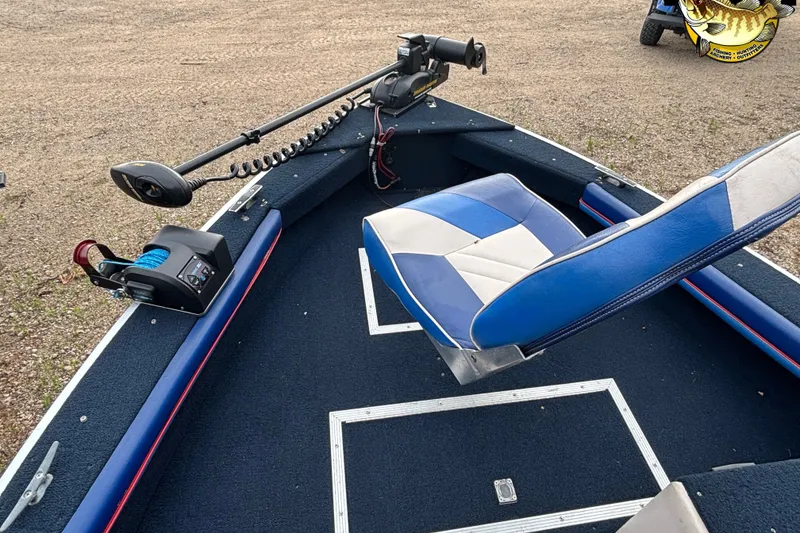 Slide: The Image of 1991 Starcraft Super Fisherman 170 boat interior with blue and white seating and fishing equipment. - 7