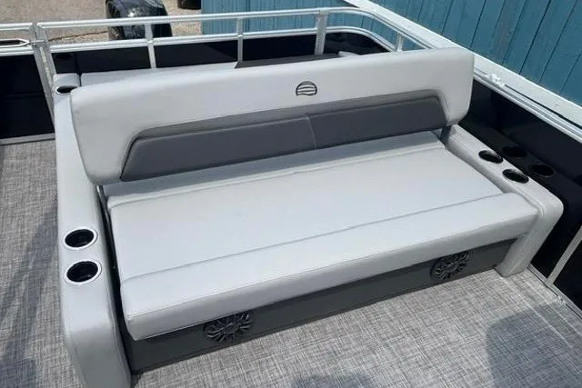 Slide: The Image of 2026 Sun Tracker Party Barge 22 RF XP3 seating area with cup holders and speakers. - 14