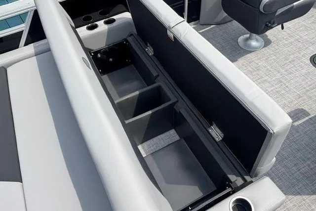 Slide: The Image of Interior view of 2026 Sun Tracker Party Barge 22 RF XP3 with open storage compartment. - 15