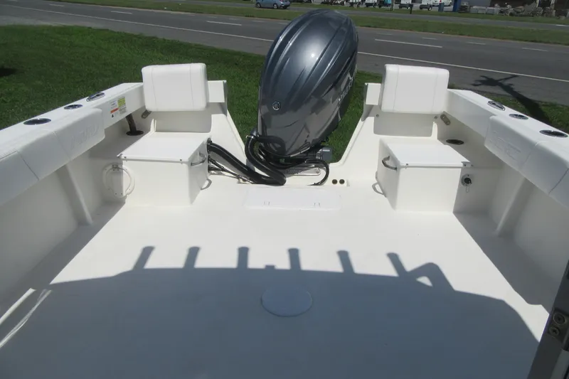 Slide: The Image of Parker 217 Explorer 2027 boat interior with outboard motor and seating. - 19
