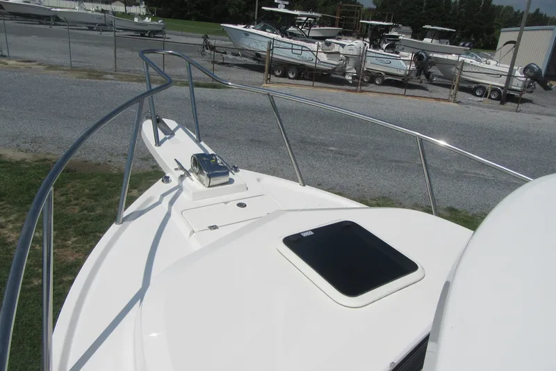 Slide: The Image of Bow view of 2027 Parker 217 Explorer boat in a marina setting. - 9
