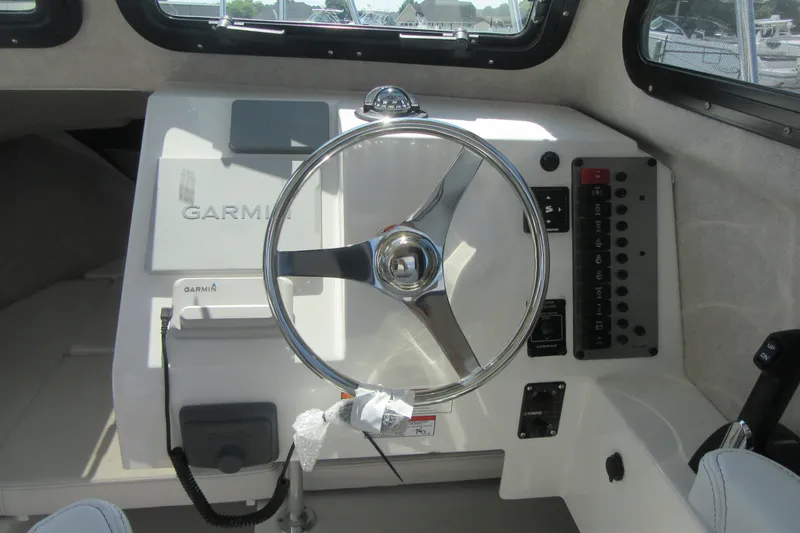 Slide: The Image of Steering console of 2027 Parker 217 Explorer boat with Garmin navigation system. - 16
