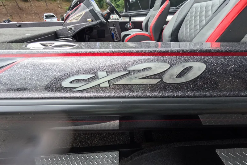 Slide: The Image of 2021 Caymas CX20 boat interior with logo and seating detail. - 16