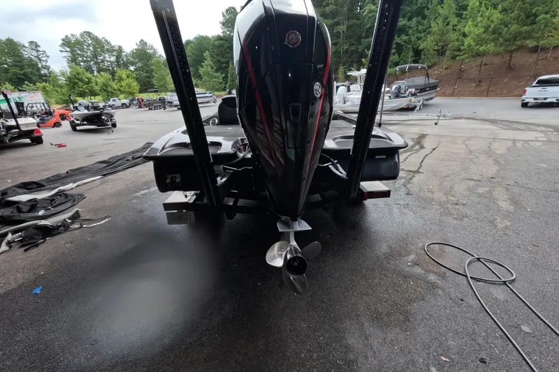Slide: The Image of 2021 Caymas boat rear view with outboard motor in a parking area. - 9
