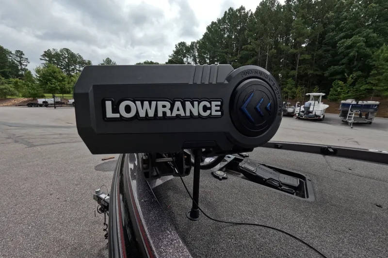 Slide: The Image of Lowrance device on 2021 Caymas boat, surrounded by trees and parked boats. - 24