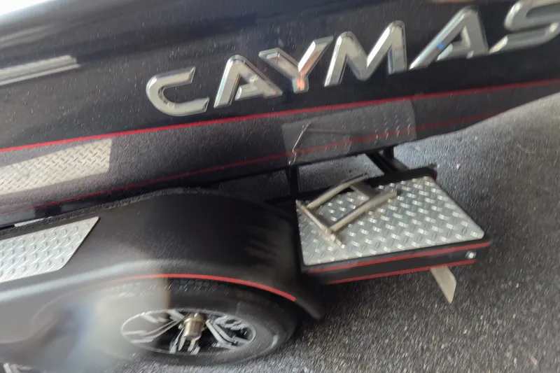 Slide: The Image of 2021 Caymas boat trailer with diamond plate step and logo detail. - 17