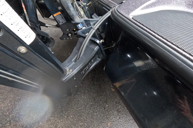 Slide: The Image of 2021 Caymas boat motor mount and components on wet pavement. - 8