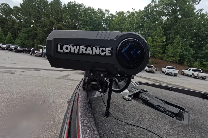 Slide: The Image of Lowrance equipment on a 2021 Caymas boat in a parking lot with trees. - 15