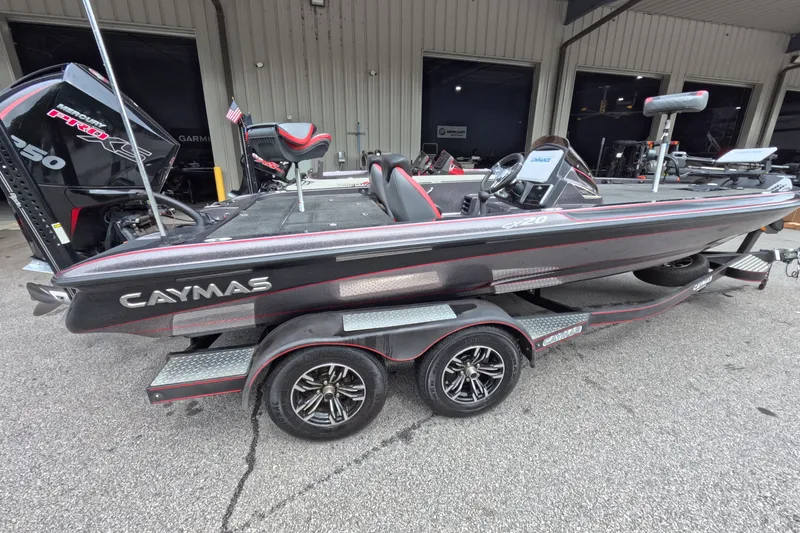 Slide: The Image of 2021 Caymas boat on trailer, featuring sleek design and powerful engine. - 19