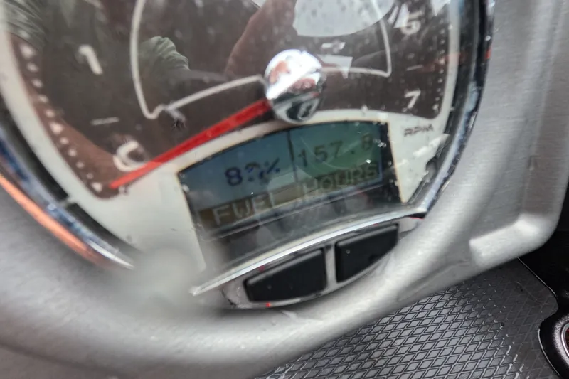 Slide: The Image of Close-up of a 2021 Caymas boat gauge showing 82% fuel level and RPM dial. - 12