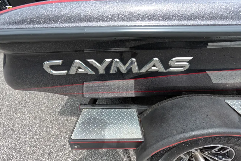 Slide: The Image of 2021 Caymas boat with metallic finish and diamond plate step detail. - 34