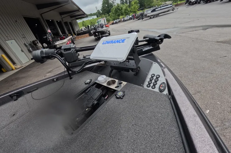 Slide: The Image of 2021 Caymas boat with Lowrance electronics and trolling motor in a marina setting. - 3