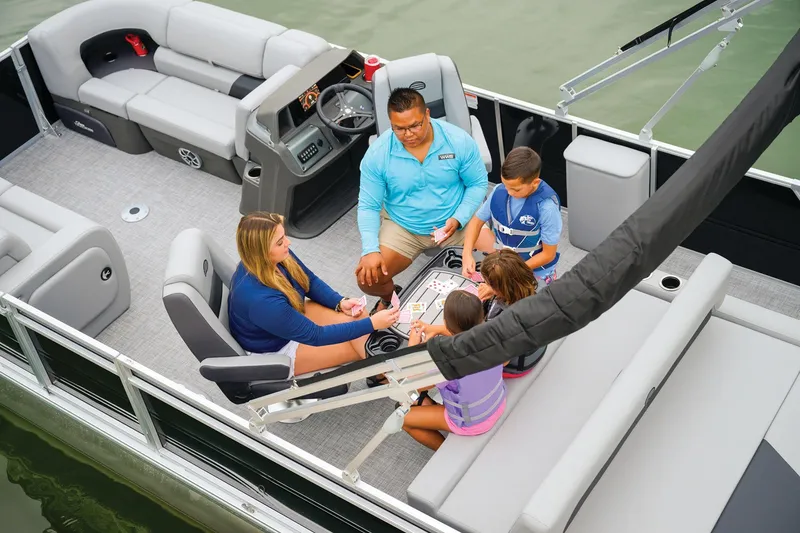 Slide: The Image of Manufacturer Provided Image: Family playing cards on 2026 Sun Tracker Party Barge 22 RF DLX pontoon boat. - 29