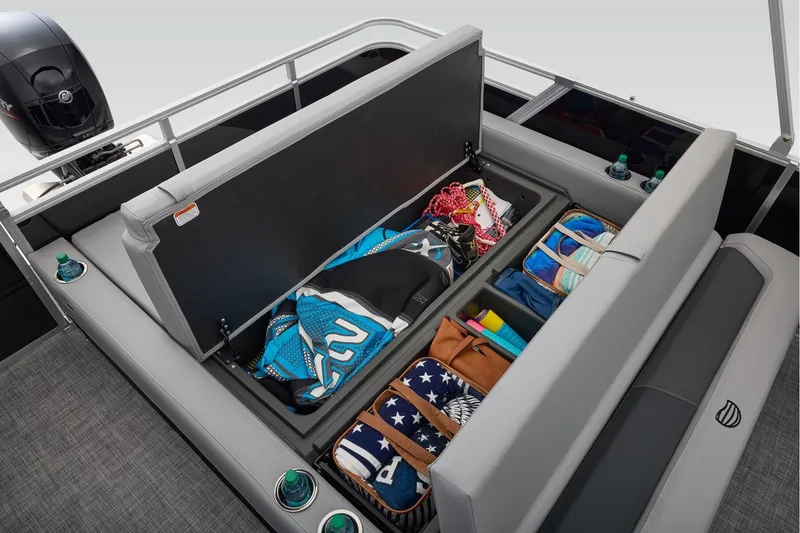 Slide: The Image of Manufacturer Provided Image: 2026 Sun Tracker Party Barge 22 RF DLX with open storage compartments and organized gear. - 25