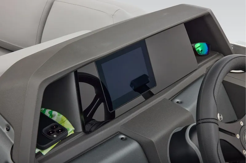 Slide: The Image of Manufacturer Provided Image: 2026 Sun Tracker Party Barge 22 RF DLX dashboard with touchscreen and steering wheel. - 22