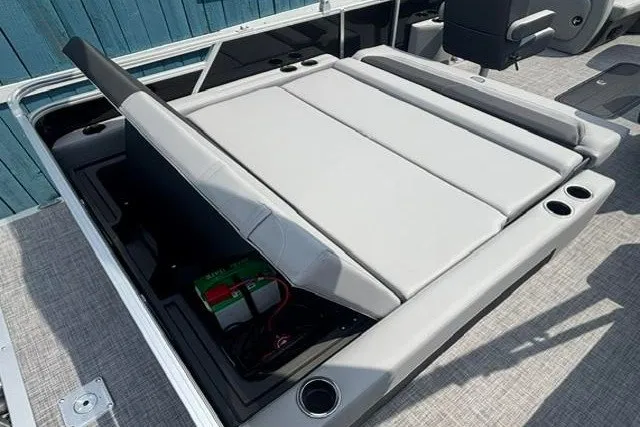 Slide: The Image of 2027 Sun Tracker Party Barge 22 RF DLX with open storage compartment and seating. - 12