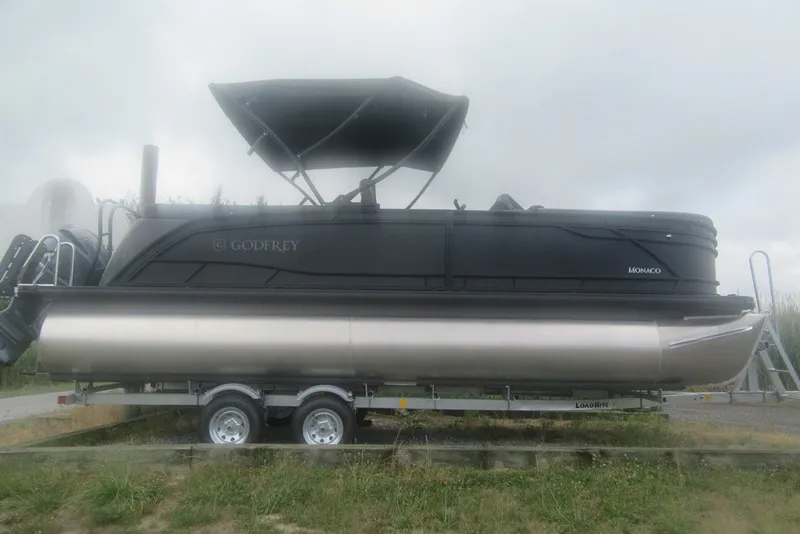 The Image of 2027 Godfrey Monaco 235 ULC pontoon boat on trailer, side view. - 1