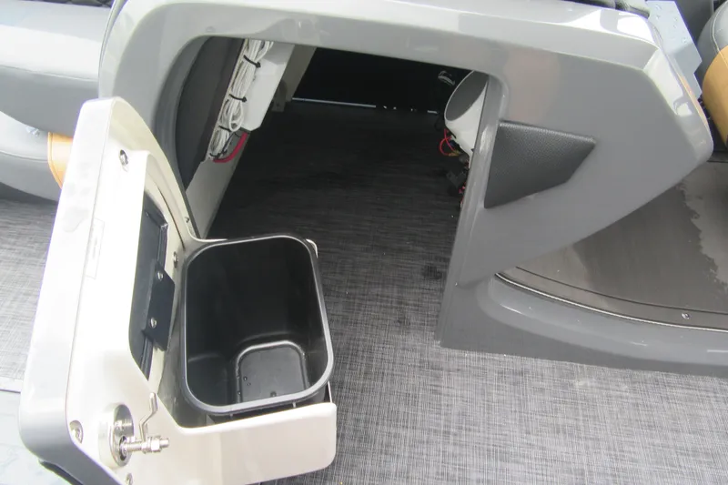 Slide: The Image of Interior view of 2027 Godfrey Monaco 235 ULC boat with storage compartment open. - 15