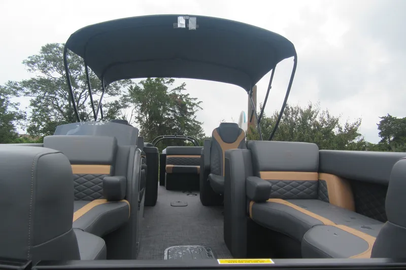Slide: The Image of 2027 Godfrey Monaco 235 ULC pontoon boat interior with luxurious seating and canopy. - 4