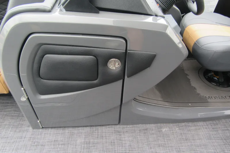 Slide: The Image of 2027 Godfrey Monaco 235 ULC boat interior with sleek gray console and seating. - 16