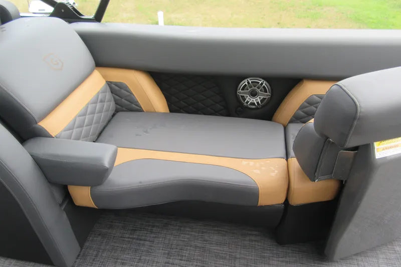 Slide: The Image of Luxurious seating in the 2027 Godfrey Monaco 235 ULC boat, featuring premium upholstery and speaker system. - 11