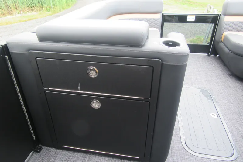 Slide: The Image of Interior of 2027 Godfrey Monaco 235 ULC boat with storage compartments and seating. - 13