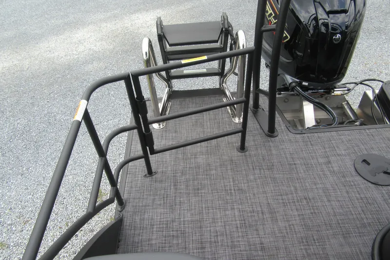 Slide: The Image of 2027 Godfrey Sweetwater 2286 SFLC boat deck with railing and motor. - 18