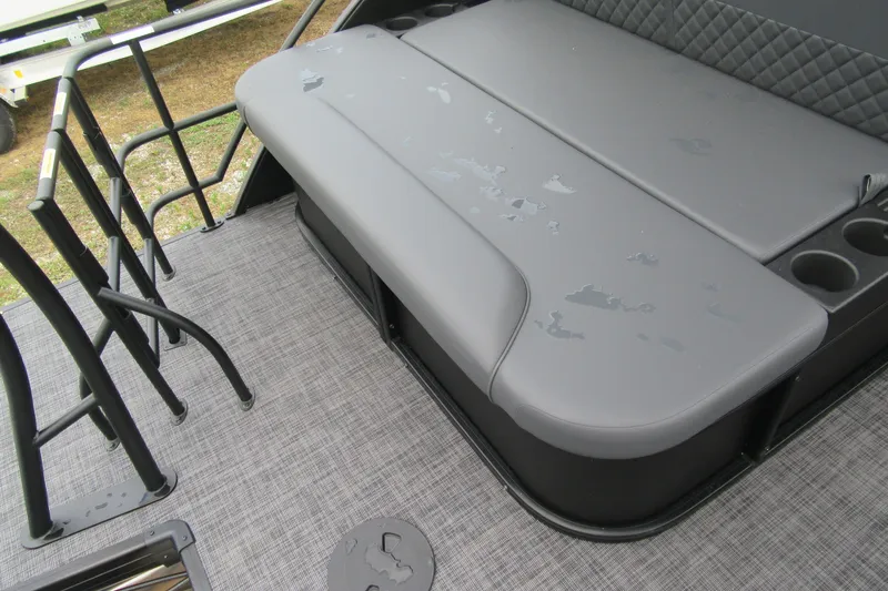 Slide: The Image of 2027 Godfrey Sweetwater 2286 SFLC boat interior with gray seating and cup holders. - 16
