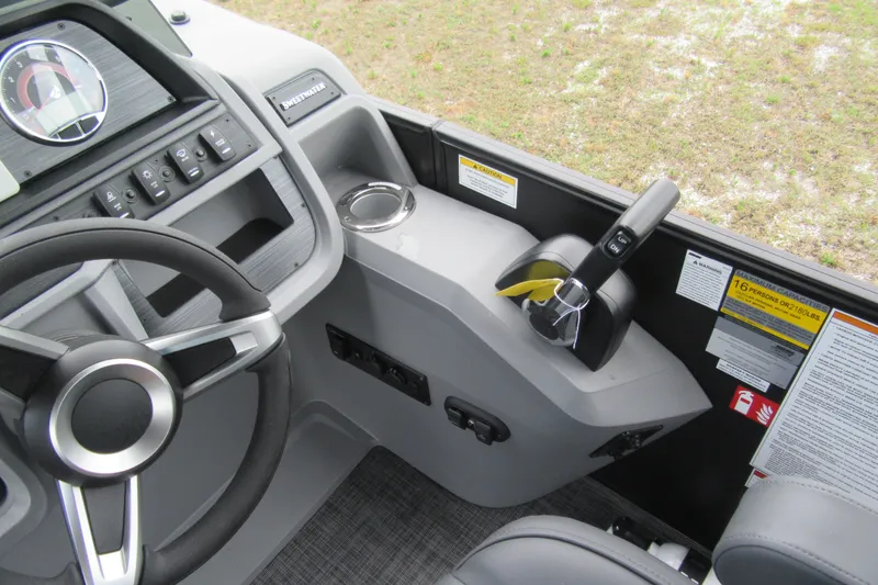 Slide: The Image of Interior view of 2027 Godfrey Sweetwater 2286 SFLC boat dashboard and controls. - 11