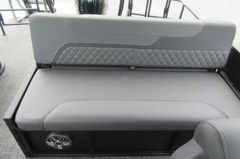 Slide: The Image of 2027 Godfrey Sweetwater 2286 SFLC boat seat with quilted gray upholstery and speaker. - 14