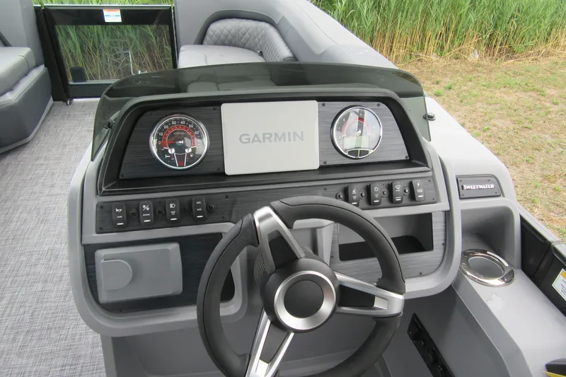 Slide: The Image of Steering console of 2027 Godfrey Sweetwater 2286 SFLC boat with Garmin display and controls. - 9