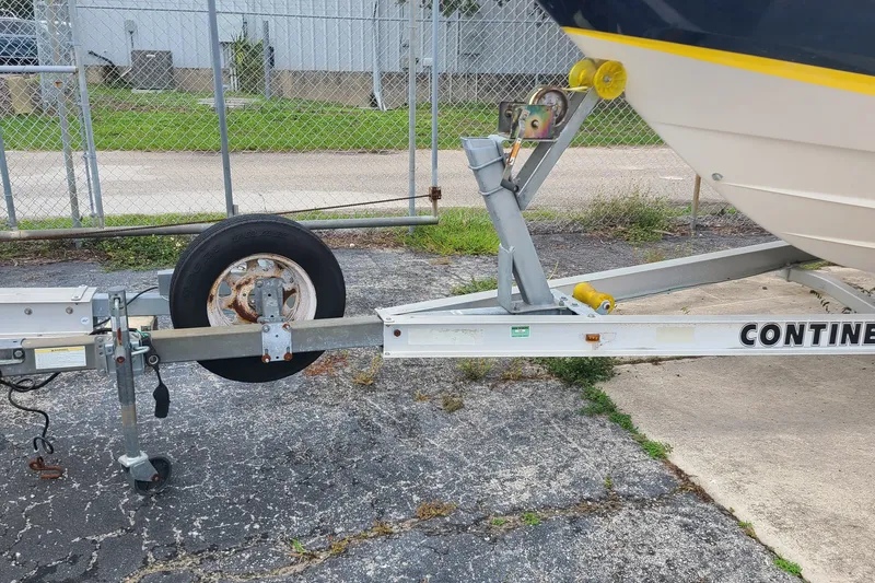 Slide: The Image of Trailer hitch of a 2005 Regal 2200 Bowrider boat on a Continental trailer. - 22