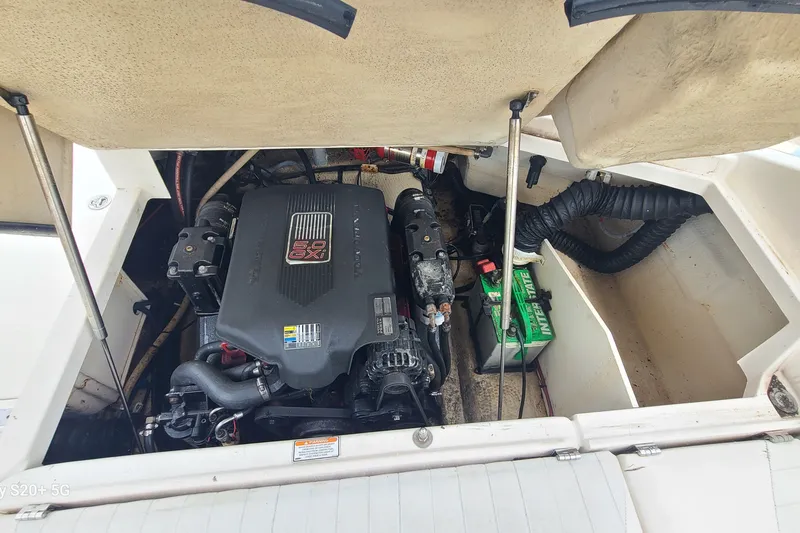 Slide: The Image of 2005 Regal 2200 Bowrider engine compartment with visible battery and components. - 13
