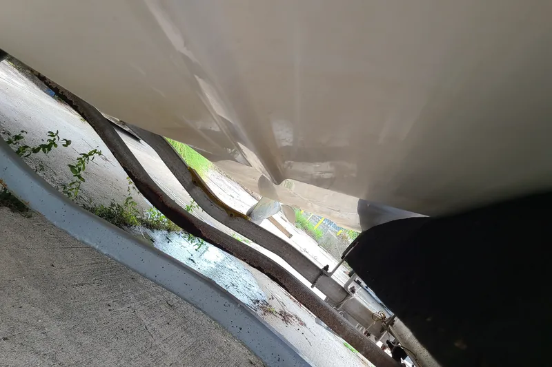 Slide: The Image of Underside view of a 2005 Regal 2200 Bowrider boat on a trailer. - 21