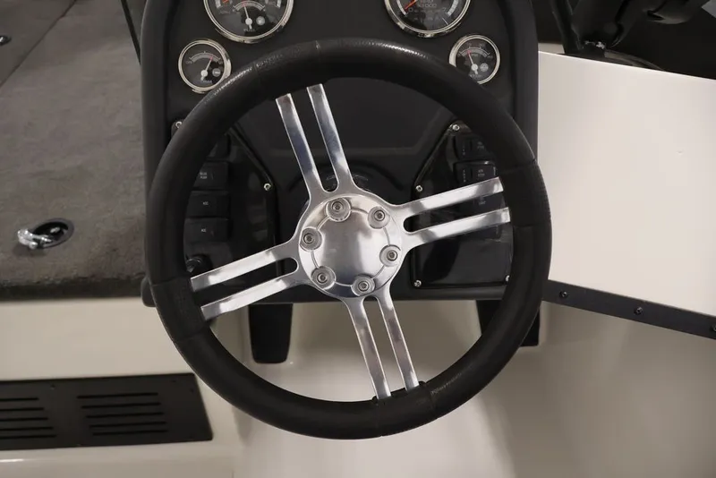 Slide: The Image of Steering wheel and dashboard of 2012 Ranger 1860 Angler boat. - 23
