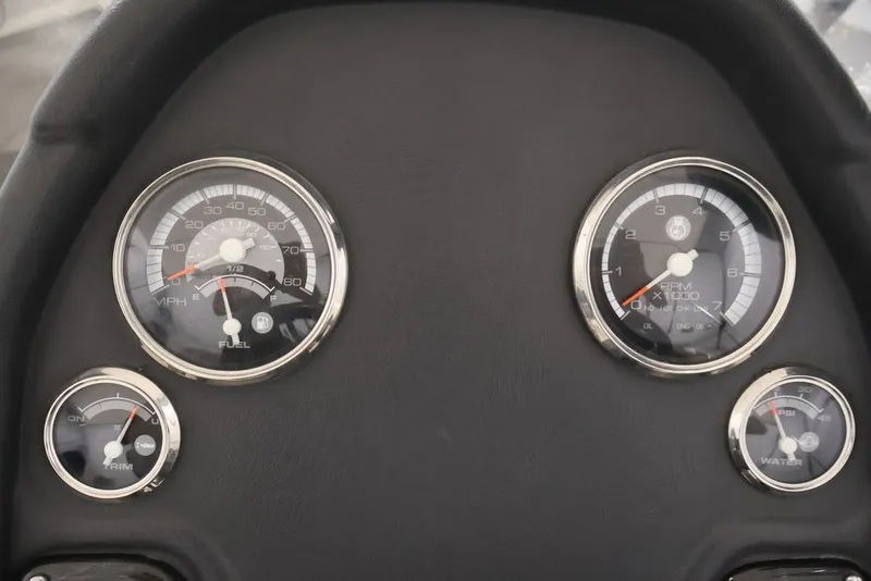 Slide: The Image of Dashboard gauges of a 2012 Ranger 1860 Angler boat, showing speed, RPM, and fuel levels. - 28