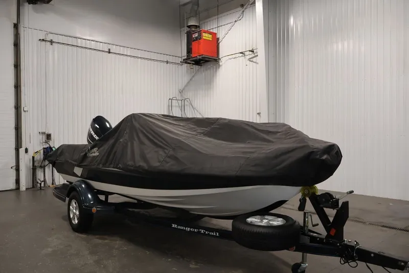 Slide: The Image of 2012 Ranger 1860 Angler boat covered in a garage, on a trailer. - 40
