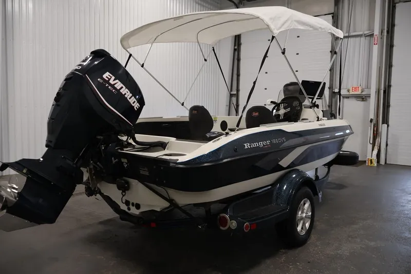 Slide: The Image of 2012 Ranger 1860 Angler boat with Evinrude motor in indoor storage. - 3