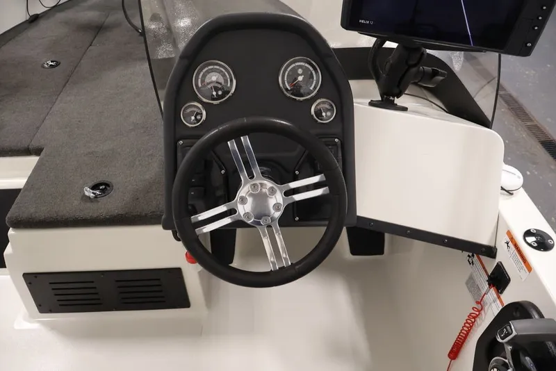 Slide: The Image of Steering console of 2012 Ranger 1860 Angler boat with gauges and controls. - 21