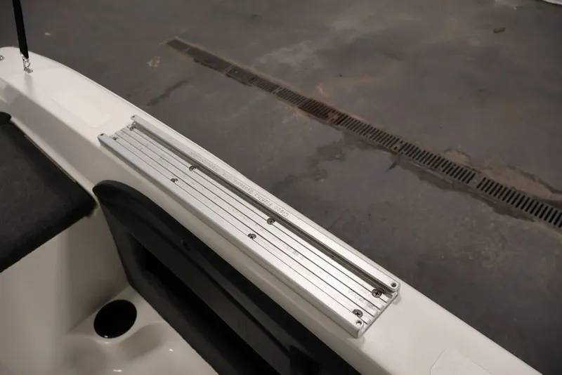 Slide: The Image of 2012 Ranger 1860 Angler boat interior with metal rail detail. - 22