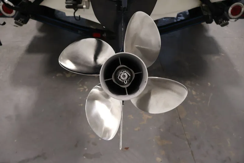 Slide: The Image of Propeller of 2012 Ranger 1860 Angler boat, close-up view in a garage setting. - 38