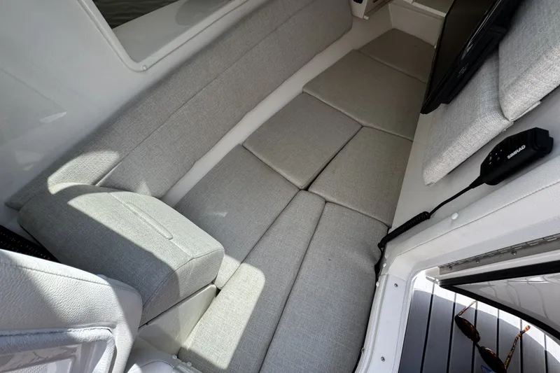 Slide: The Image of Interior cabin of 2021 Sea Ray SLX 350 Outboard with gray seating. - 20