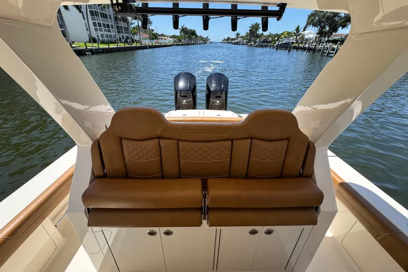 Slide: The Image of Luxurious seating on 2021 Scout 425 LXF boat, cruising through a scenic waterway. - 33