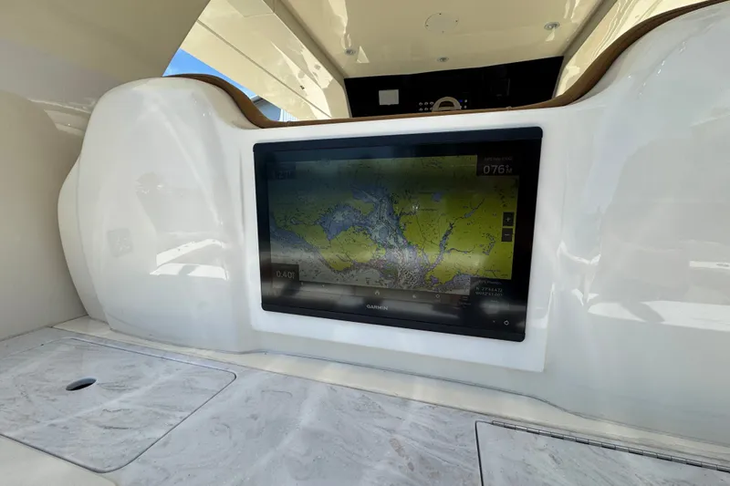 Slide: The Image of 2021 Scout 425 LXF boat with Garmin navigation display on sleek dashboard. - 36