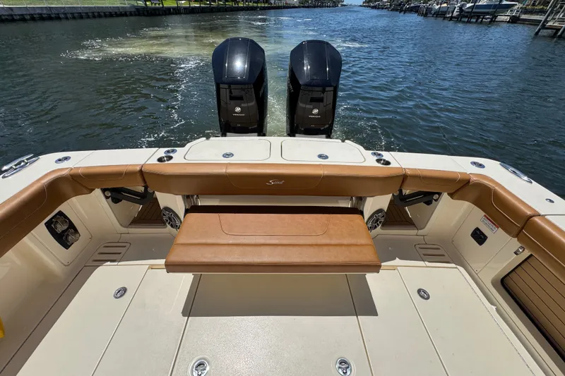 Slide: The Image of 2021 Scout 425 LXF boat with dual outboard engines on a sunny day. - 37