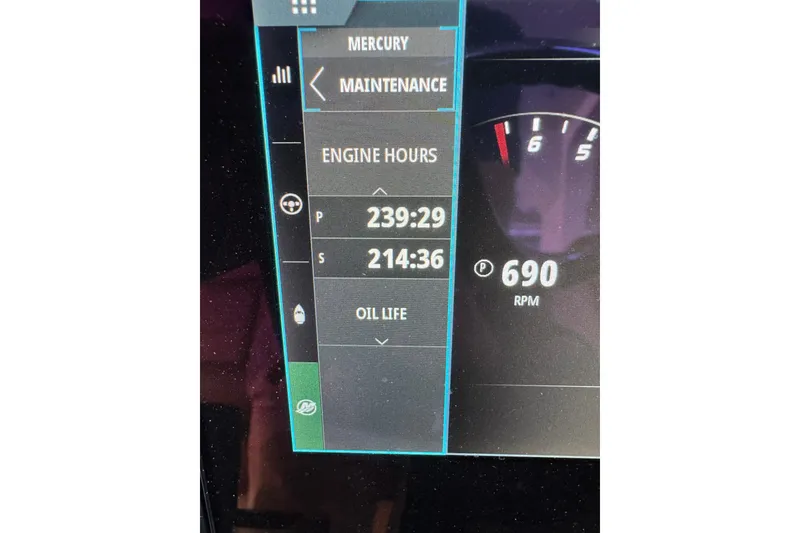 Slide: The Image of Display panel of 2021 Scout 425 LXF showing engine hours and RPM. - 42